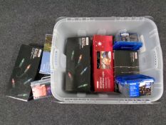 A box containing a large quantity of boxed Christmas lights