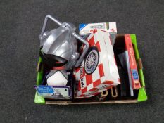 A box of miscellany to include a Cyberman helmet, Harry Potter audio CD's, stamp albums,