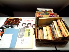 A box of a large quantity of books and calendars relating to The Beatles,