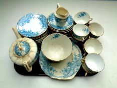 Two trays of antique Rosebery china tea service together with a tray containing vintage tin,