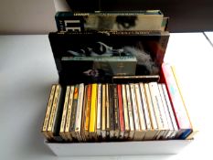 A box of a large quantity of CD's and books relating to The Beatles