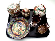 A tray containing 20th century oriental wares to include famille rose teapot with wicker handle,