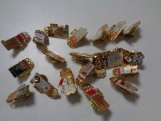 A collection of enamelled Olympic badges by Kodak