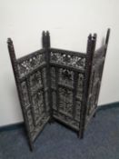 A 19th century carved hardwood three way folding screen