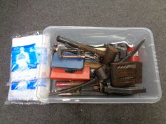 A box containing assorted hand tools, G clamps, pick axe head,