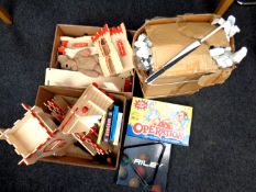 Two boxes containing children's toys to include wooden fort, board games, Riley pool balls,