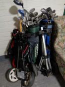 Three golf bags of assorted irons and drivers to include Dunlop, Ben Sayers, Big Bursar,