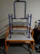 A set of portable two tier workshop steps together with a portable workshop table