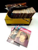 A box of a large quantity of 1980's Beatles Monthly books together with a quantity of unframed