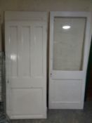 Two 20th century painted pine panel doors together with a further pine painted door with a glass