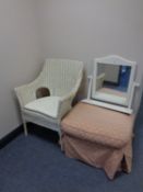 A painted wicker basket chair together with an upholstered footstool and a painted dressing table