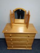 A Julian Bowen four drawer pine chest with triple mirror