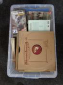 A plastic crate containing a large quantity of 78s, CDs, cassettes and VHS tapes,