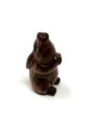 A carved hardwood netsuke - Seated rabbit
