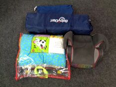 A Baby Dan travel cot together with a booster seat,