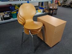A set of four contemporary beech stacking chairs on metal legs together with a three drawer office