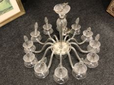 A contemporary all glass 12-branch chandelier