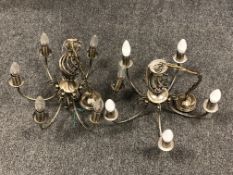 A pair of antique brass finish six-branch light fittings (2)