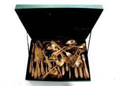 A canteen of brass cutlery