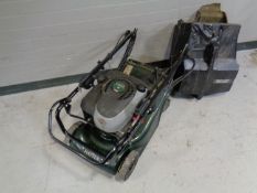 A Hayter Harrier 41 petrol lawn mower with grass box