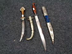Two 20th century Persian knives in scabbards