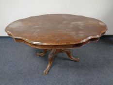 A shaped Victorian pedestal breakfast table
