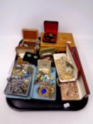 A tray containing a quantity of costume jewellery to include simulated pearls, brooches, cuff links,