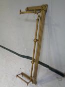 An antique brass fire fender