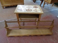 A blonde oak wall shelf together with a blonde oak tile topped occasional table