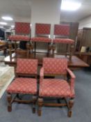 An oak refectory dining table on bulbous legs together with a set of six chairs upholstered in a