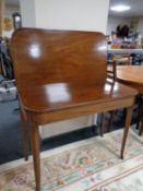 A 19th century inlaid mahogany turnover top tea table