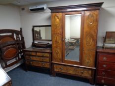 A late 19th century three piece bedroom suite comprising of mirror door wardrobe,