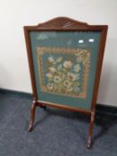 An Edwardian mahogany tapestry fire screen