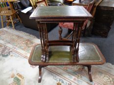 A leather topped coffee table together with a nest of three leather topped tables