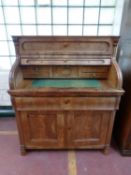 A 19th century mahogany roll front bureau