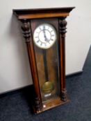 An early 20th century Vienna wall clock with brass and enamelled dial