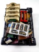 A basket containing a quantity of die cast vehicles,