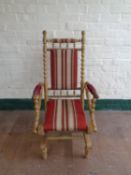 A blonde oak bobbin American style rocking chair