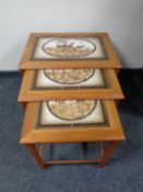 A nest of three 20th century Mobel Fabrikken Danish teak tile topped tables