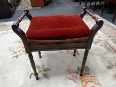 An Edwardian storage piano stool