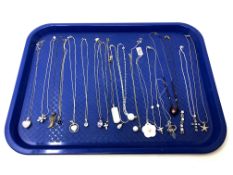 Approximately nineteen silver pendants.