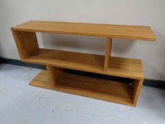 A contemporary oak three tier stand