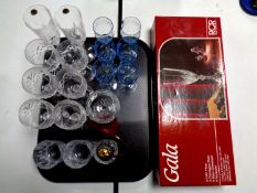 A box set of RCR champagne glasses together with a tray containing assorted drinking glasses to