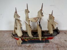 A wooden model of a four masted galleon