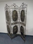 A contemporary metal three fold screen