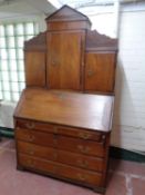 A 19th century continental oak bureau bookcase fitted cupboards above,