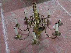 A continental brass eight branch chandelier