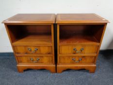 A pair of yew wood two drawer side cabinets