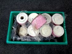 A box containing a quantity of haberdashery tape