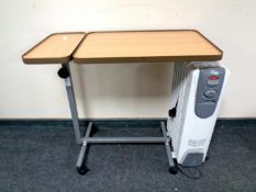 A bed table together with a Delonghi oil filled radiator